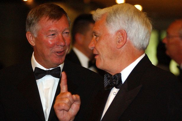 Sir Alex Ferguson and Sir Bobby Robson share an inside joke.
