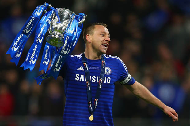 Reborn John Terry lifts the capital one cup after win against Tottenham.