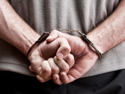 bigstock-Criminal-In-Handcuffs-14611325